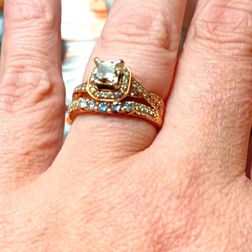 One Carat dimond ring surrounded be dimonds. Band is all dimonds. Rose gold